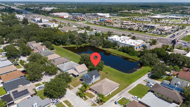 birds eye view of property featuring a water view