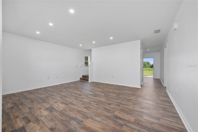 spare room with dark hardwood / wood-style floors