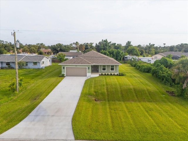 view of front facade with a front lawn and a garage