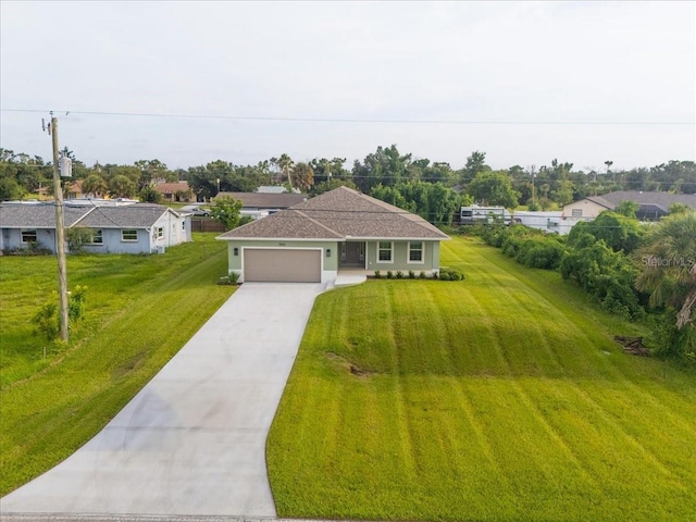 10061 Gulfstream Blvd, Englewood, FL 34224 - ranch-style home with an attached garage, driveway, and a front lawn