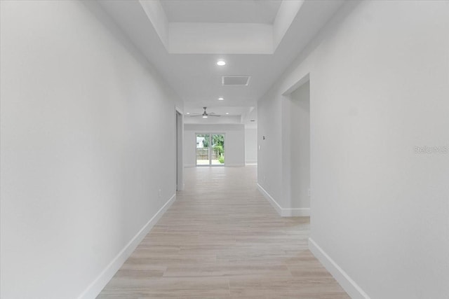 corridor featuring light hardwood / wood-style floors