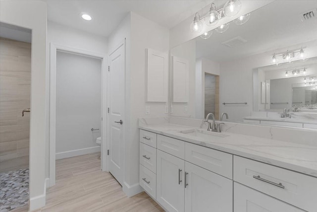 10061 Gulfstream Blvd, Englewood, FL 34224 - bathroom featuring vanity, baseboards, toilet, recessed lighting, and tiled shower