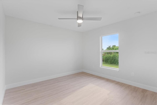 spare room featuring light wood-type flooring and ceiling fan