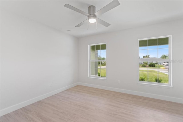 unfurnished room with ceiling fan and light hardwood / wood-style flooring