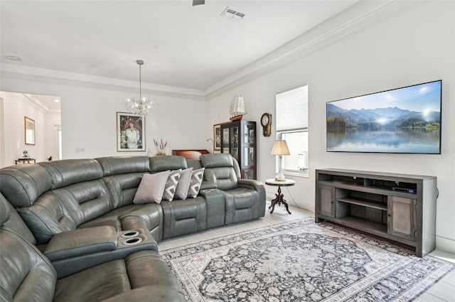 living room featuring a chandelier and crown molding