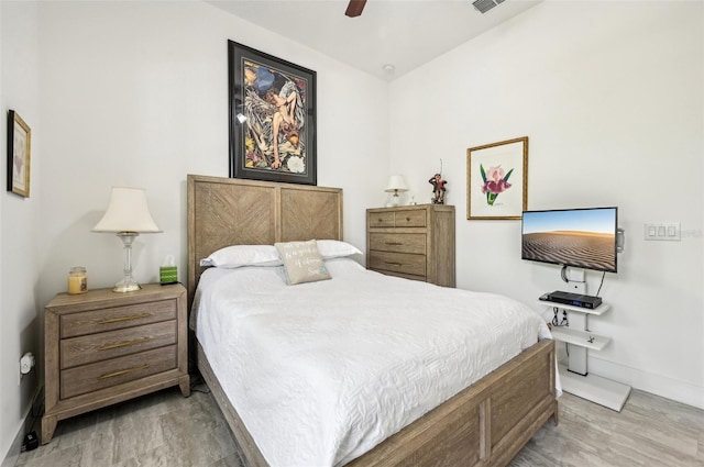 bedroom featuring light wood-type flooring and ceiling fan