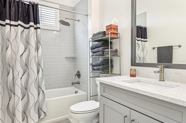 full bathroom featuring shower / bath combination with curtain, vanity, and toilet