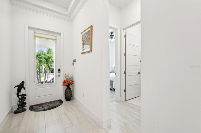 entryway featuring crown molding