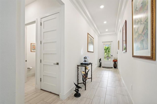 hallway featuring ornamental molding