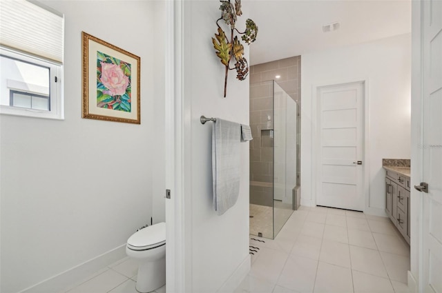 bathroom with tile patterned floors, walk in shower, vanity, and toilet