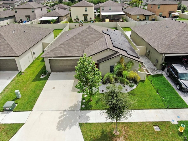 birds eye view of property with a residential view