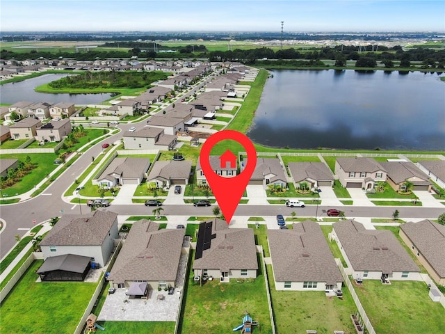 aerial view featuring a residential view and a water view