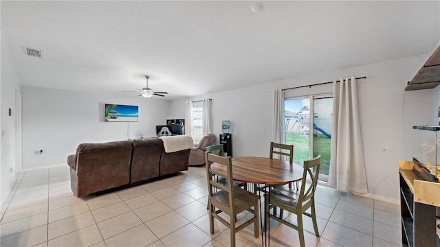 tiled dining room with ceiling fan