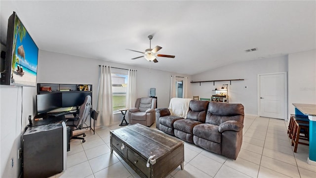living room with light tile patterned flooring, ceiling fan, lofted ceiling, and visible vents