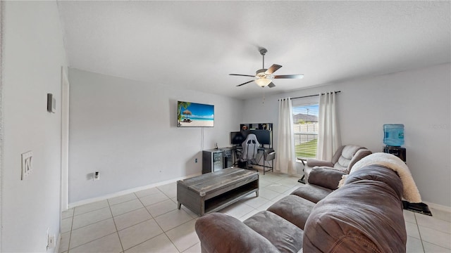 tiled living room with ceiling fan