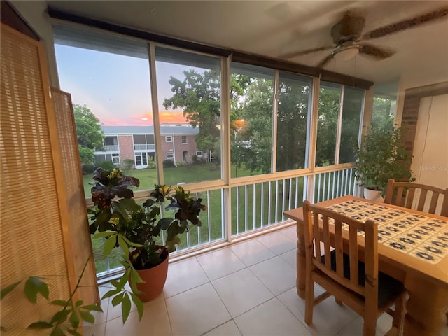 sunroom with ceiling fan and plenty of natural light