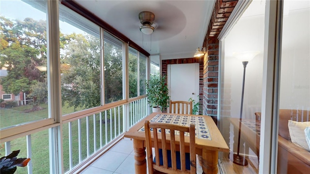 sunroom / solarium with ceiling fan