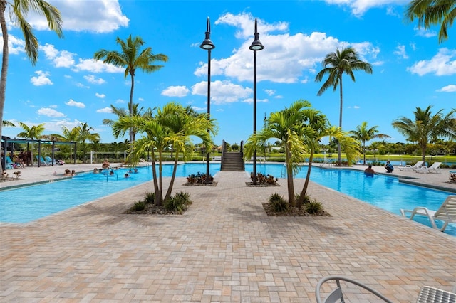 5514 Laguna Caribe Cir Unit 108, Fort Myers, FL 33905 - community pool featuring a patio