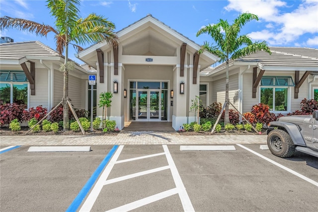 5514 Laguna Caribe Cir Unit 108, Fort Myers, FL 33905 - exterior space featuring uncovered parking and french doors