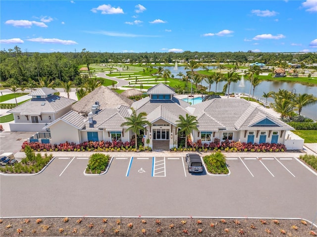 5514 Laguna Caribe Cir Unit 108, Fort Myers, FL 33905 - exterior space with a water view and uncovered parking