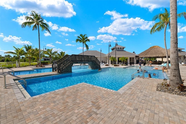 view of swimming pool featuring a patio area