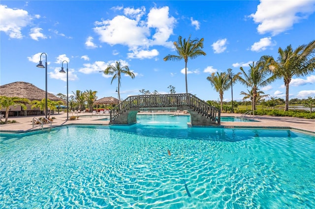 5514 Laguna Caribe Cir Unit 108, Fort Myers, FL 33905 - community pool featuring a patio and stairway