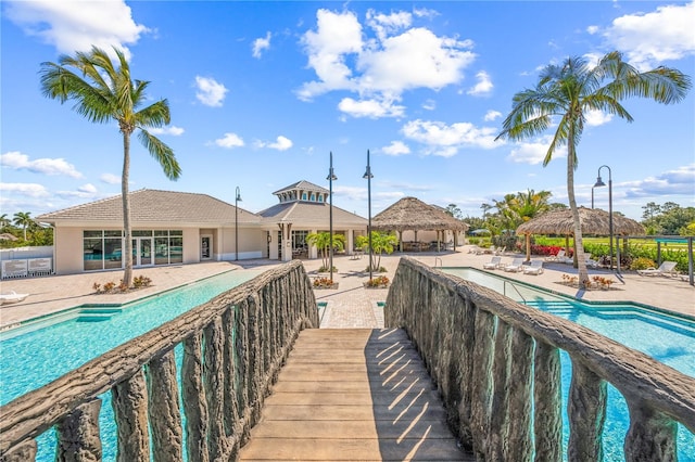 view of home's community featuring a pool, a gazebo, and a patio area