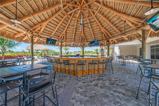 view of patio / terrace with exterior bar and a gazebo