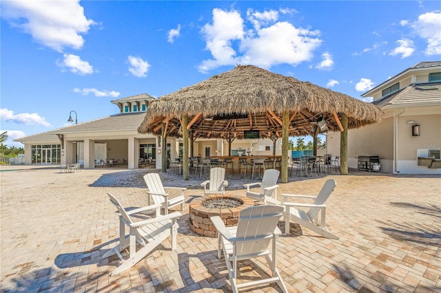 view of patio / terrace featuring a gazebo and an outdoor fire pit