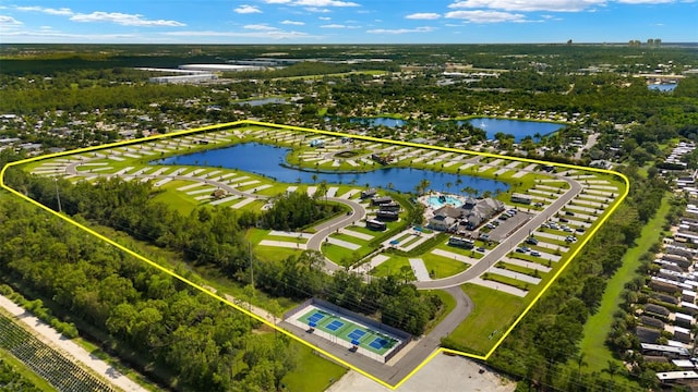 birds eye view of property with a water view