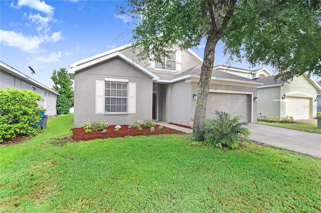 view of front of house featuring a front lawn and a garage