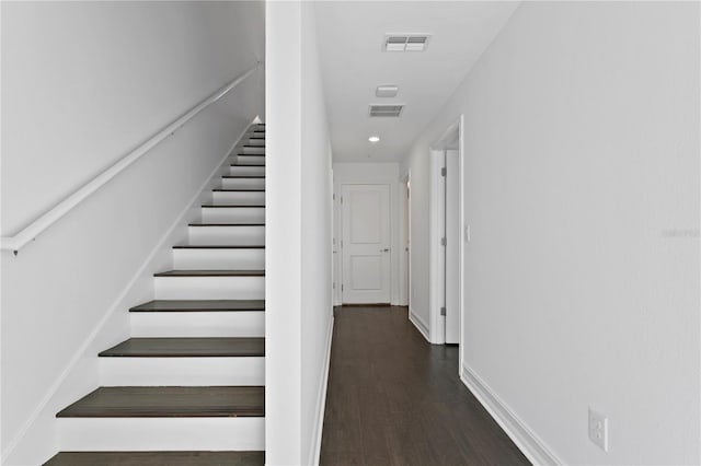 staircase featuring hardwood / wood-style floors