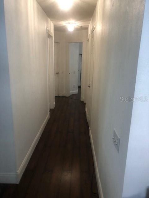 hallway featuring dark hardwood / wood-style floors