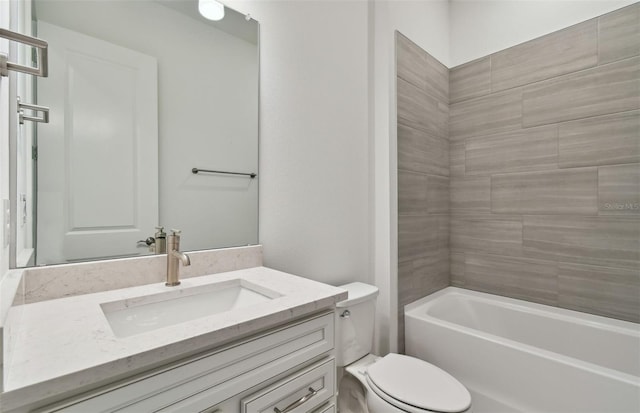 full bathroom with vanity, toilet, and tiled shower / bath