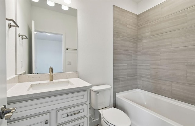 full bathroom with vanity, toilet, and tiled shower / bath