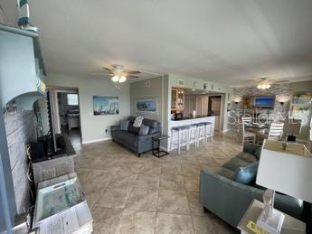 living room featuring ceiling fan