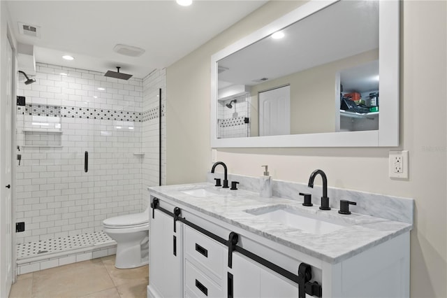 bathroom with an enclosed shower, tile patterned floors, vanity, and toilet