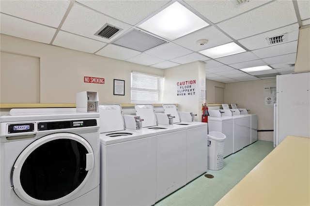 clothes washing area featuring washing machine and clothes dryer