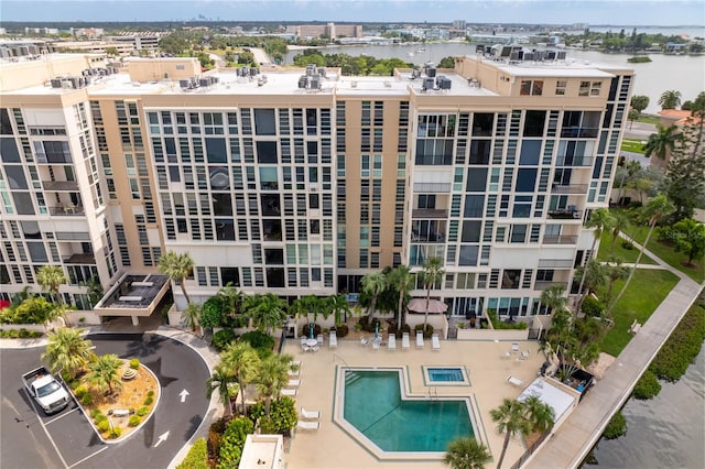 exterior space featuring a water view and a patio area