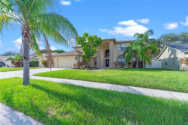 view of front of home with a garage and a front yard