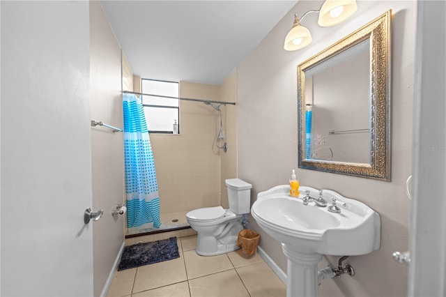 bathroom with tile patterned flooring, a shower with curtain, and toilet