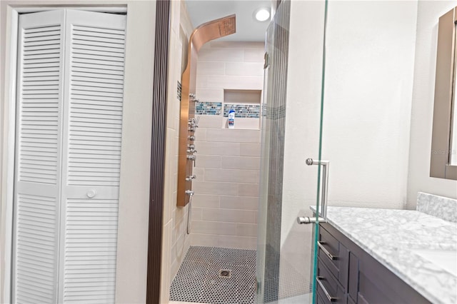 bathroom with an enclosed shower and vanity