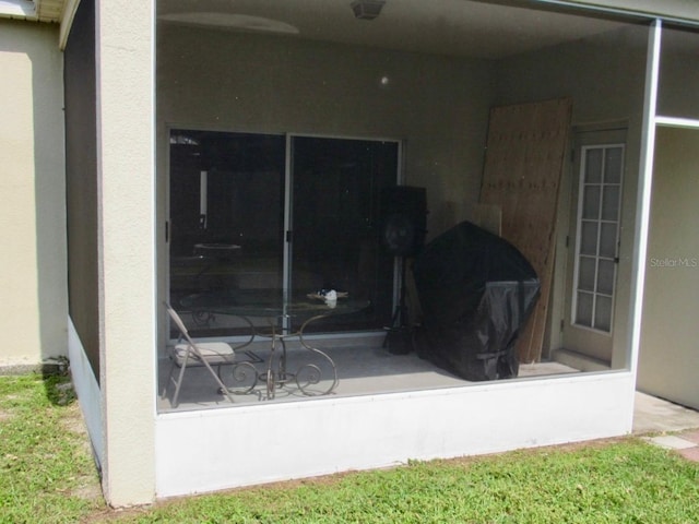 view of patio / terrace with a sunroom