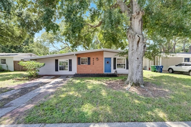 ranch-style home with a front yard