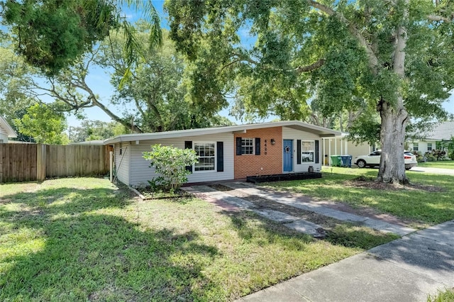 ranch-style house with a front yard