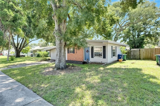 ranch-style home featuring a front yard