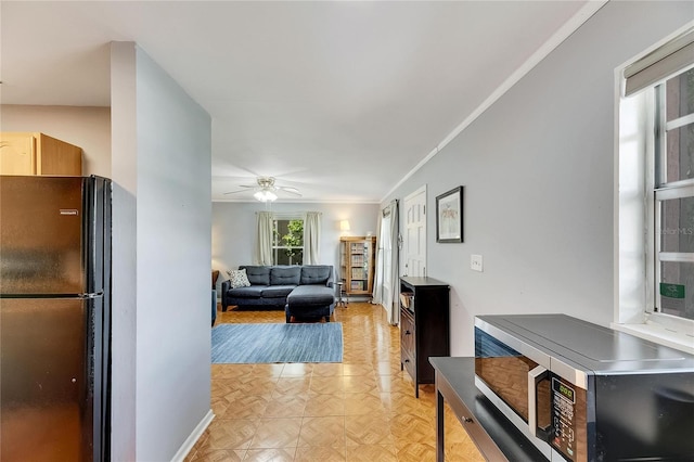 interior space with light parquet flooring and crown molding