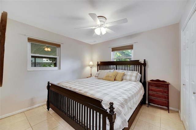 tiled bedroom featuring a closet and ceiling fan