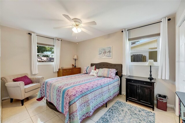 bedroom featuring ceiling fan and light tile patterned floors