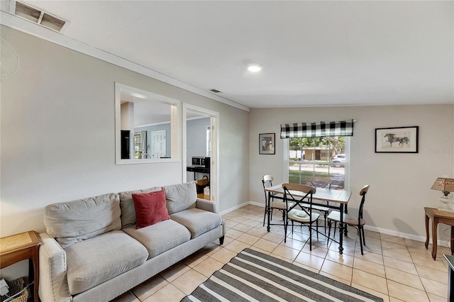 tiled living room with vaulted ceiling